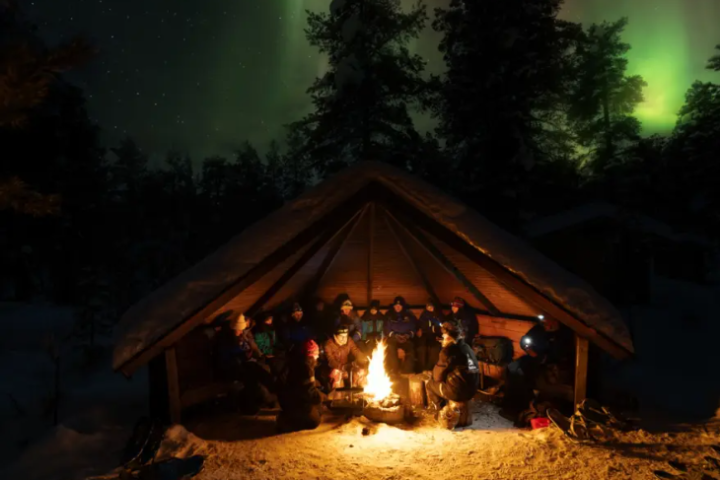 a tent with people in the dark